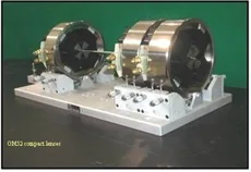 Oxford Microbeams OM52 compact quadrupole lenses on their mounting base.